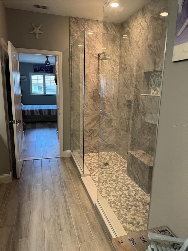 bathroom featuring tiled shower