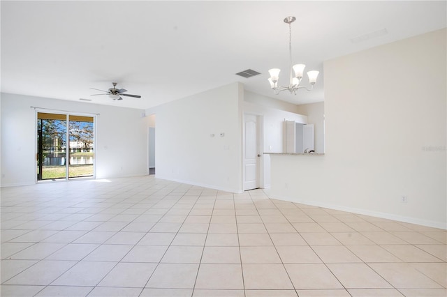 empty room featuring ceiling fan with notable chandelier and light tile patterned floors