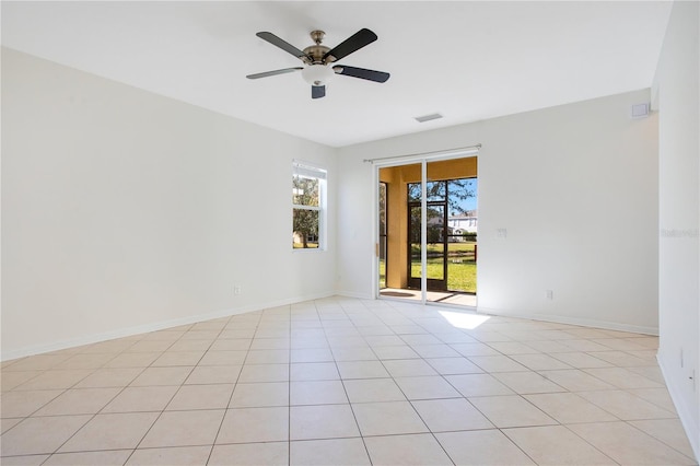 unfurnished room featuring ceiling fan and light tile patterned floors