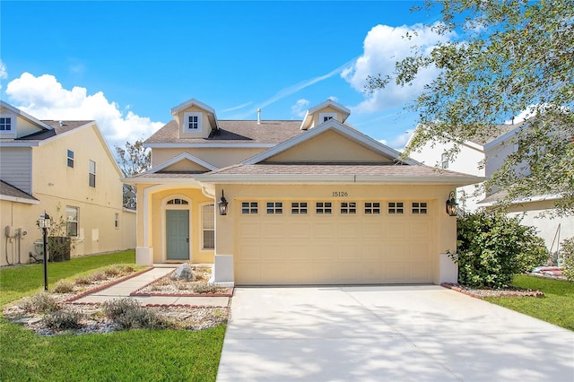 view of front of home with a garage