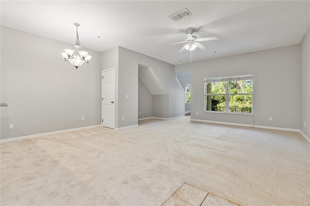 additional living space featuring ceiling fan with notable chandelier and light colored carpet