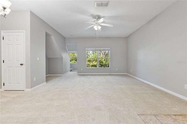 bonus room featuring light colored carpet and ceiling fan