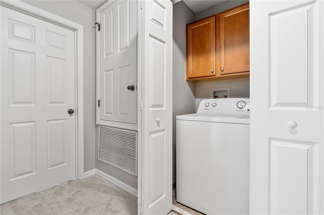 laundry room with cabinets, washer / clothes dryer, and light colored carpet