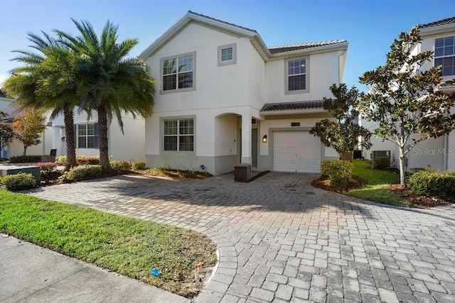 mediterranean / spanish-style house featuring a garage