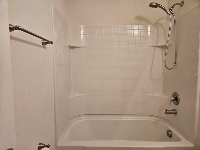 bathroom with washtub / shower combination