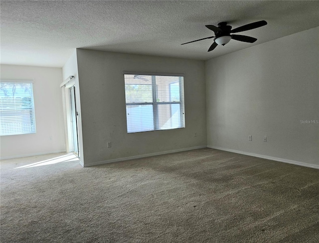 spare room with carpet flooring, ceiling fan, and a textured ceiling