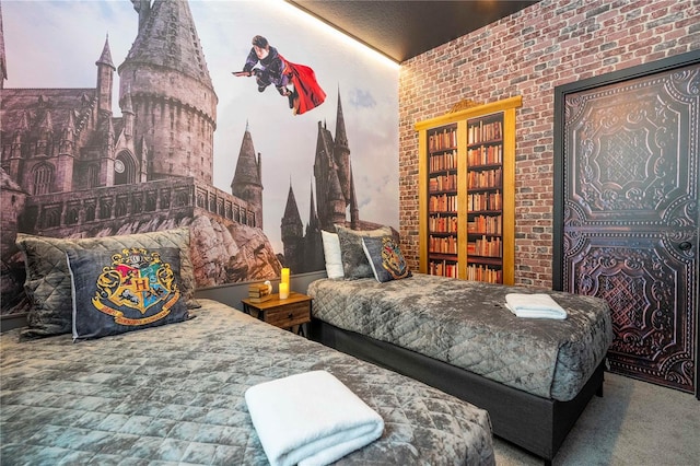 bedroom with carpet and brick wall