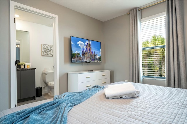 bedroom featuring connected bathroom