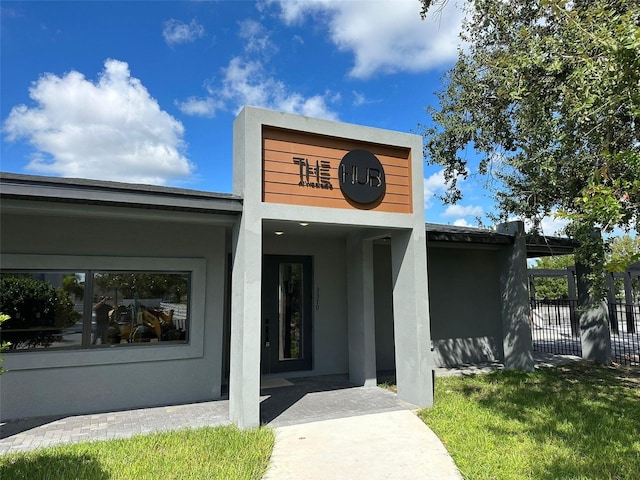 property entrance with a yard