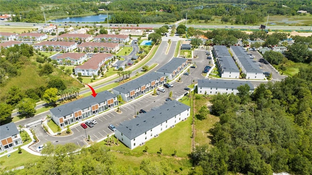 birds eye view of property with a water view