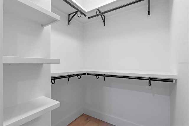 spacious closet featuring light wood-type flooring