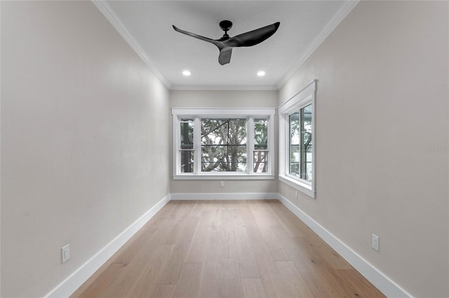 spare room with ornamental molding, light hardwood / wood-style floors, and ceiling fan