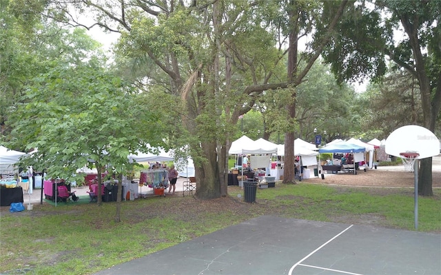 view of yard featuring basketball court