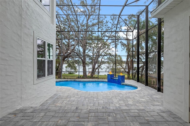 view of pool featuring a lanai and a patio area