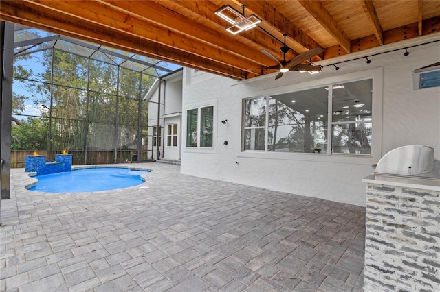 view of swimming pool featuring area for grilling, a patio, and ceiling fan