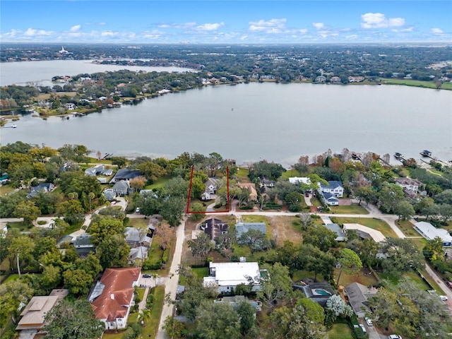 bird's eye view featuring a residential view and a water view