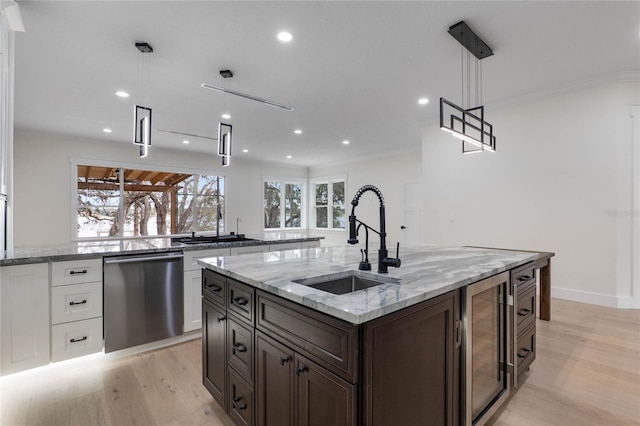 kitchen with a sink, stainless steel dishwasher, white cabinetry, wine cooler, and light wood finished floors