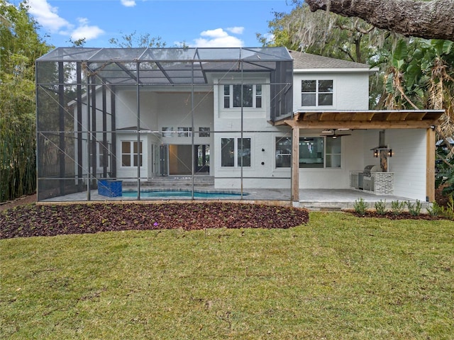 back of house with a patio area, an outdoor pool, a lanai, and a yard