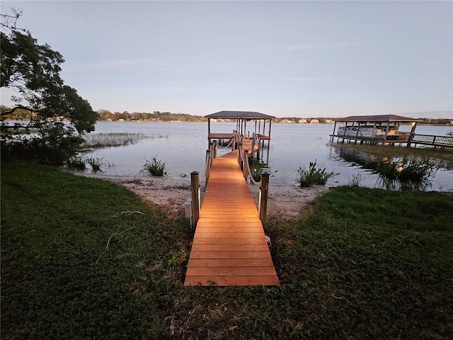 view of dock featuring a water view and boat lift