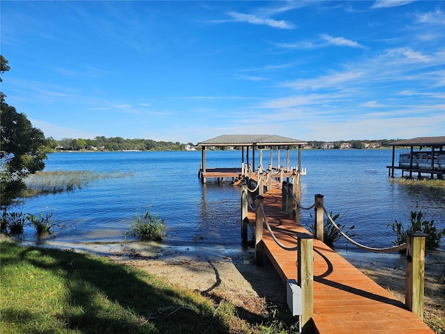 view of dock featuring boat lift and a water view