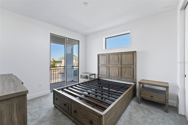 bedroom featuring access to outside and light carpet