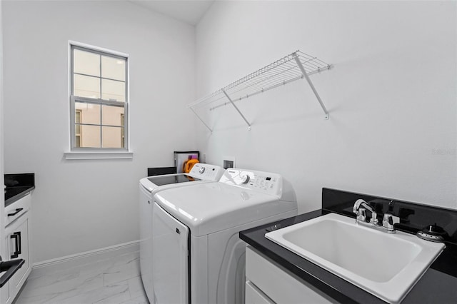 laundry area with cabinets, sink, and washing machine and clothes dryer