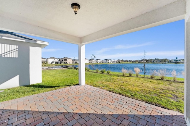 view of patio featuring a water view