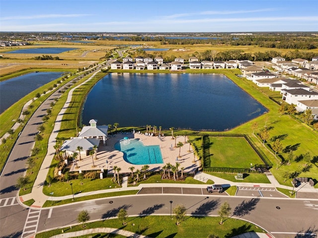 birds eye view of property featuring a water view