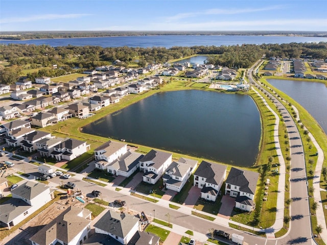 birds eye view of property with a water view