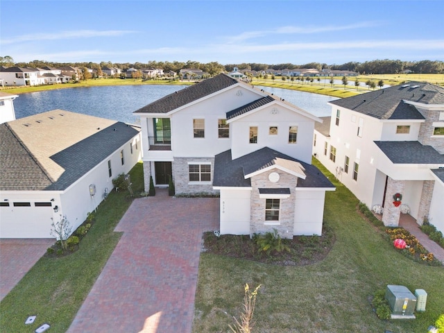 birds eye view of property featuring a water view