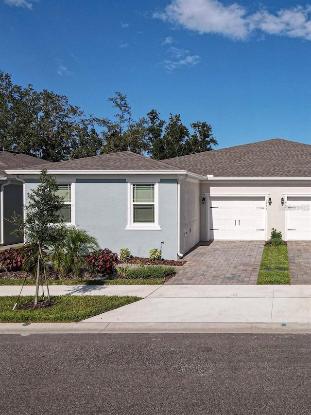 ranch-style home with a garage