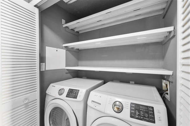 laundry area with washer and clothes dryer