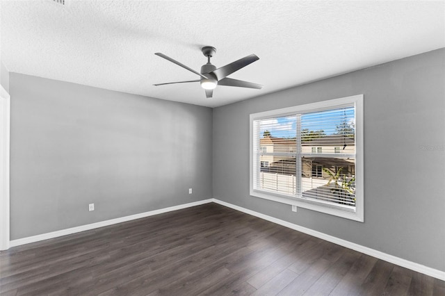 spare room featuring a textured ceiling, dark hardwood / wood-style floors, and ceiling fan