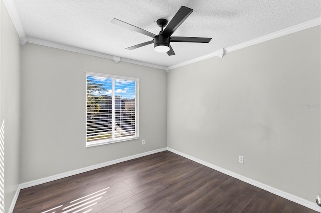 spare room featuring ceiling fan, dark wood-type flooring, a textured ceiling, and ornamental molding