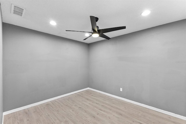 spare room featuring ceiling fan and light hardwood / wood-style flooring