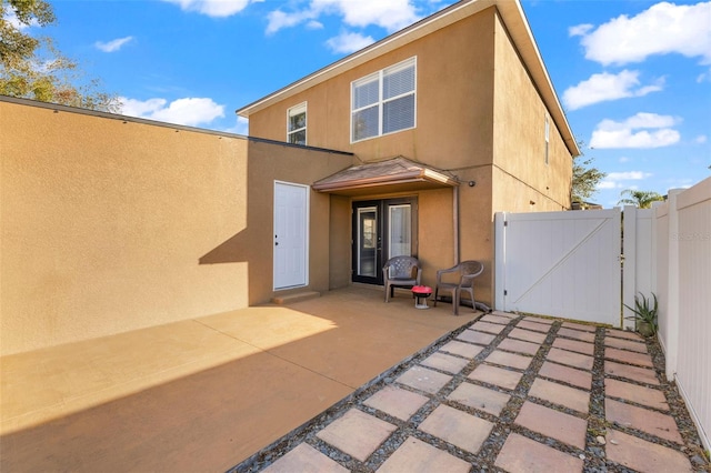 rear view of house featuring a patio