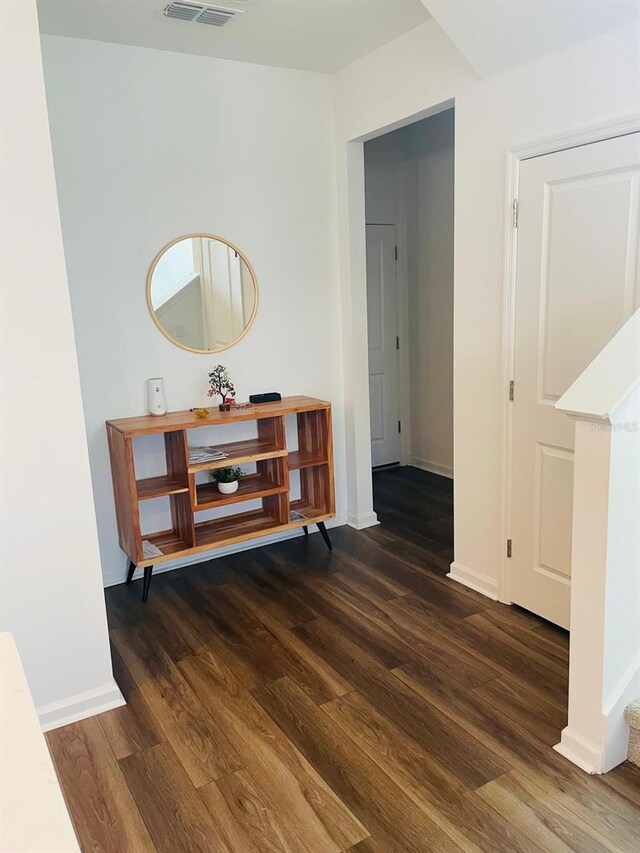 hall featuring dark wood-type flooring