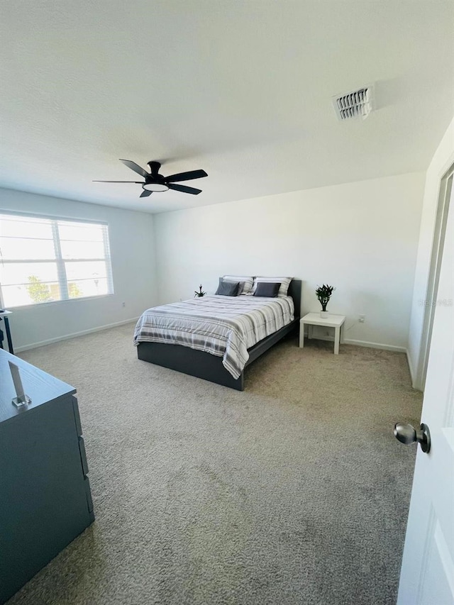 carpeted bedroom with ceiling fan