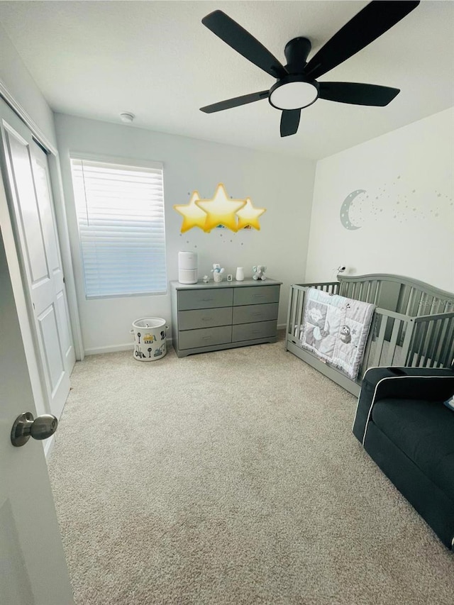 carpeted bedroom featuring ceiling fan