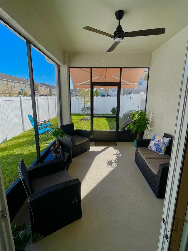 sunroom / solarium with ceiling fan