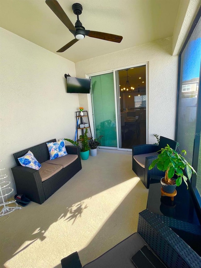 view of patio featuring ceiling fan