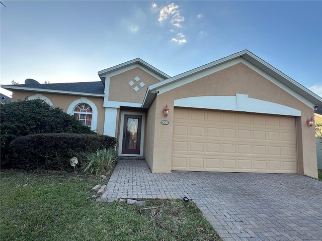 single story home with a garage