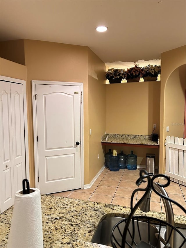 interior space featuring light tile patterned flooring