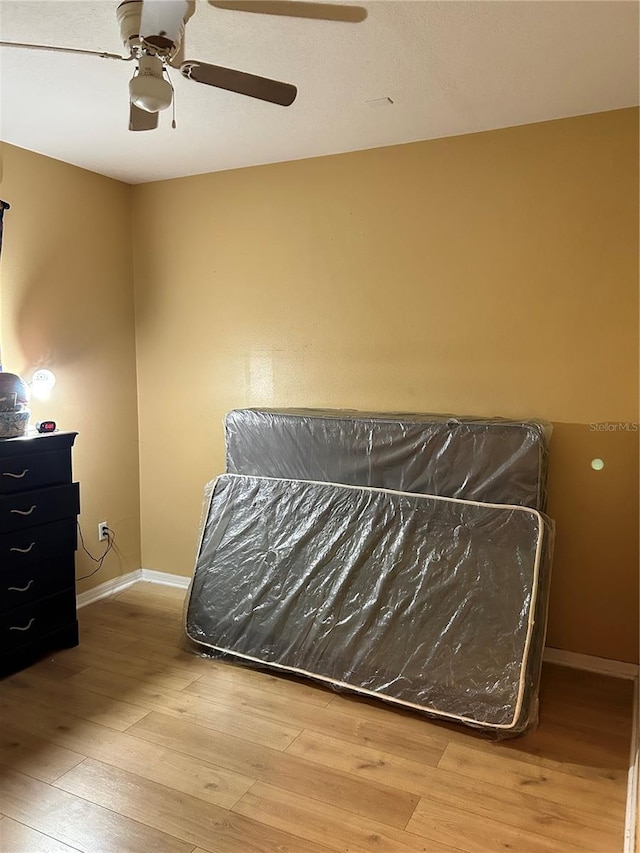 bedroom featuring hardwood / wood-style flooring and ceiling fan