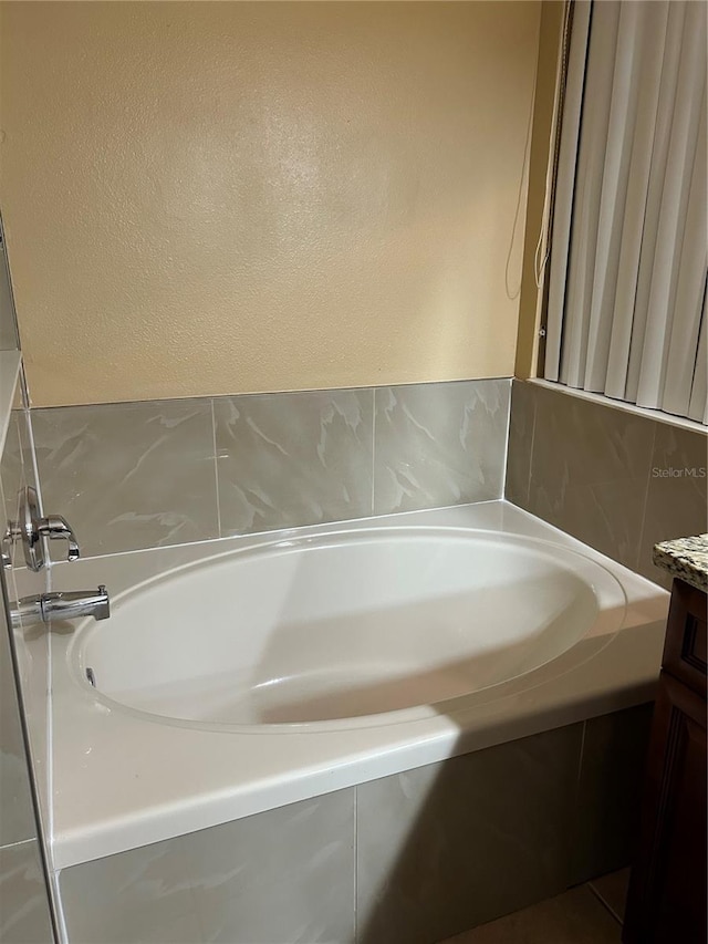 bathroom featuring vanity and a bathtub