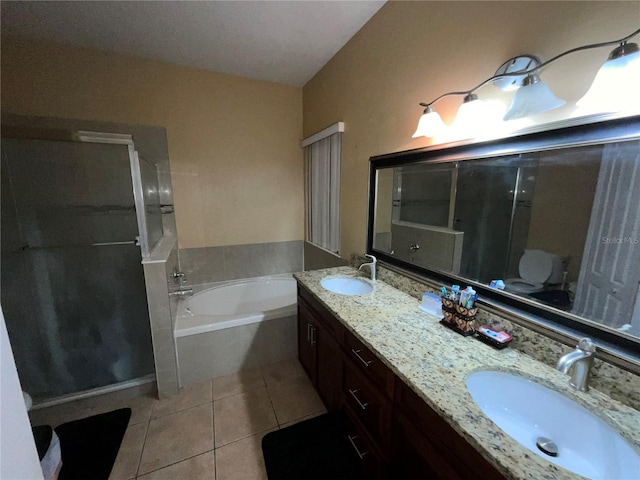 bathroom with tile patterned flooring, vanity, and plus walk in shower