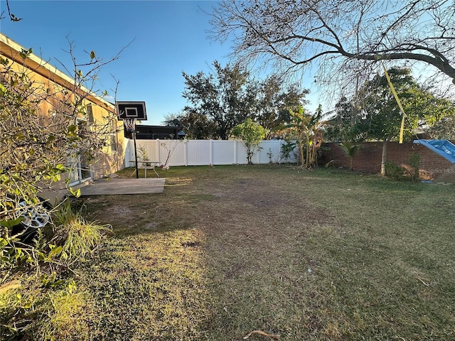 view of yard with basketball court