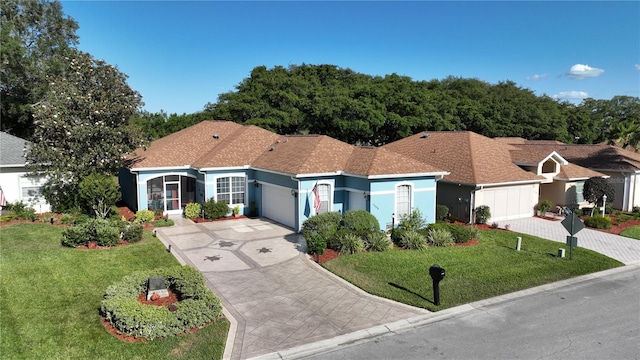 ranch-style home featuring a front yard and a garage