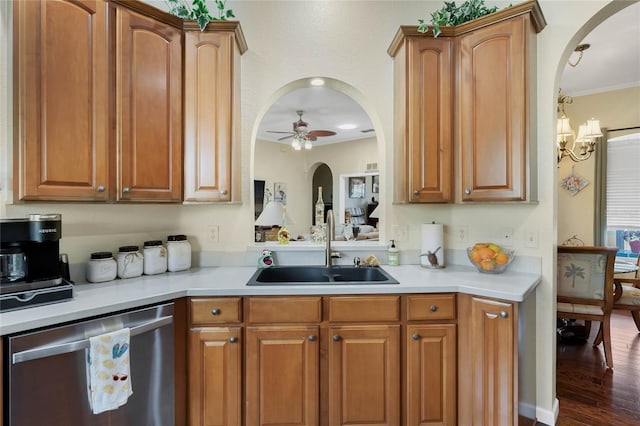 kitchen featuring stainless steel dishwasher, ornamental molding, ceiling fan with notable chandelier, sink, and dark hardwood / wood-style floors