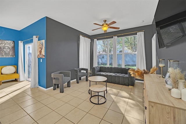 living room with ceiling fan and light tile patterned floors